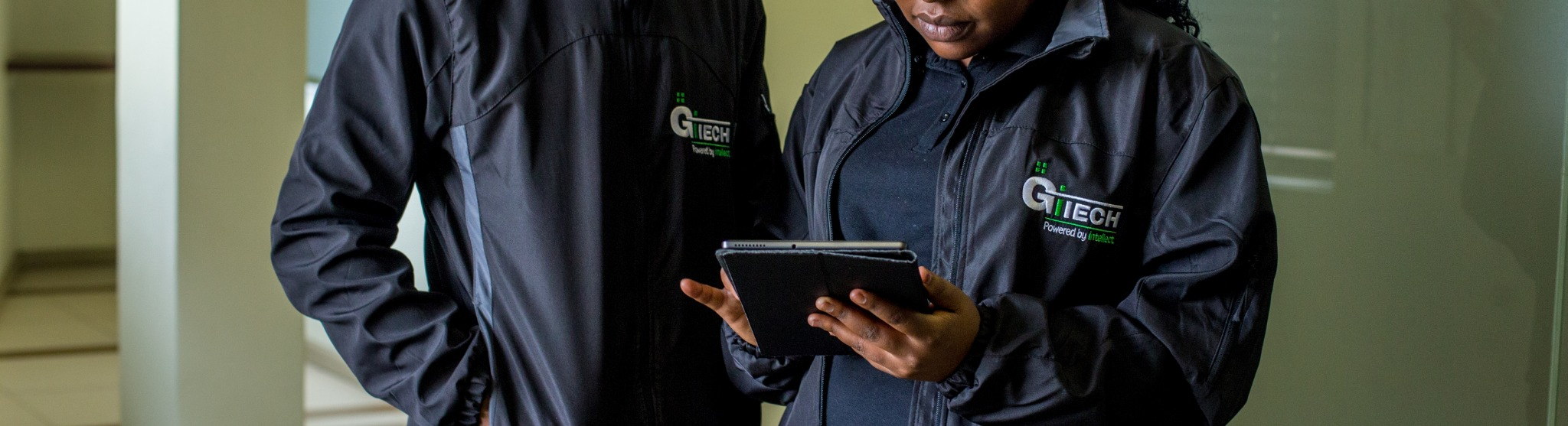 GITECH team collaborating around a tablet