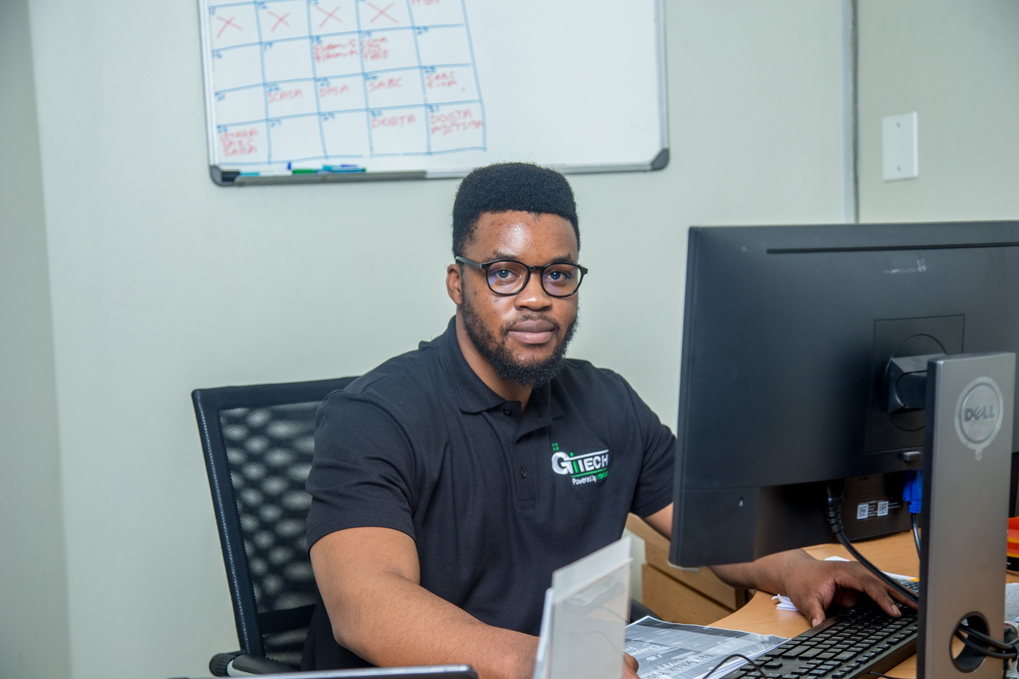 GITECH team member providing hands-on workstation support