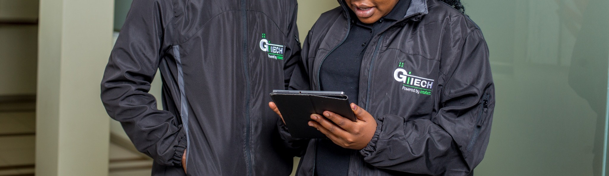 GITECH product team reviewing a tablet together