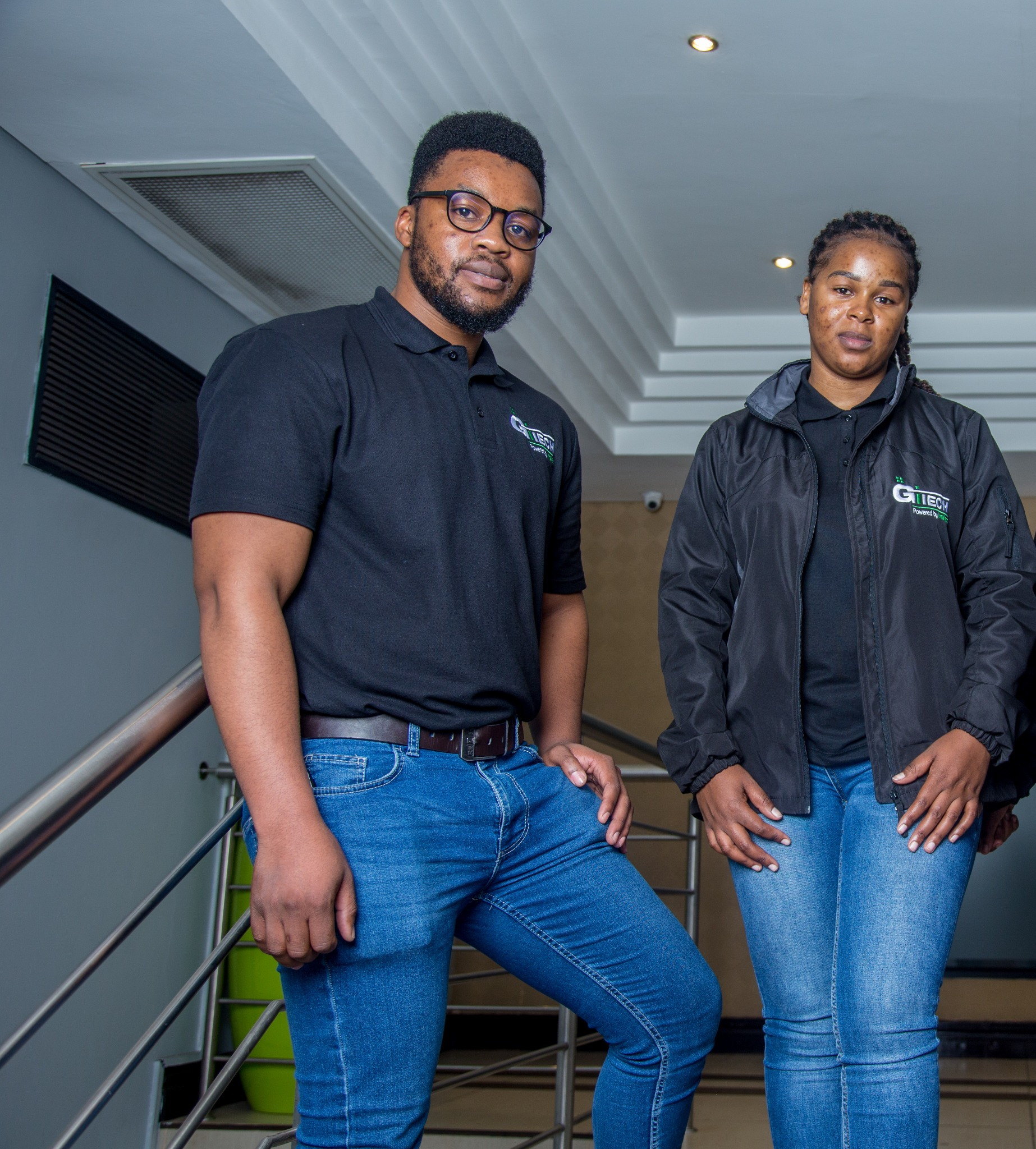Two GITECH team members standing together